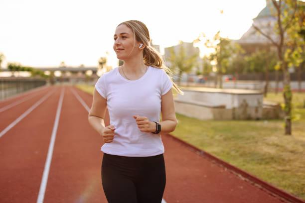 istock Woman running in urban environment 1401038183
