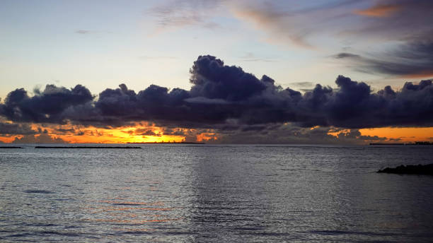 istock dramatic sunset over the sea and cloudy sky 1401040353