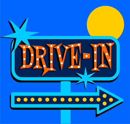 Vintage drive-in movies sign with arrow