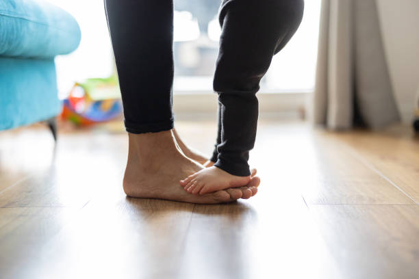 istock Baby son standing on mothers feet 1401044248