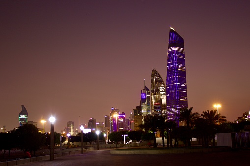 Skyscrapers illuminated at night in Kuwait City