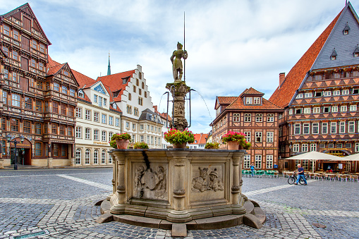 Hildesheim, Germany - August 16, 2012: Historic buildings and fountain in Marktplatz Market Square in Hildesheim