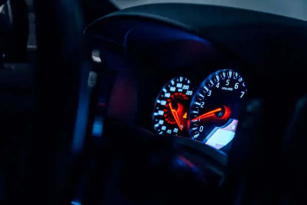 Tachometer and speedometer in a car, in KM