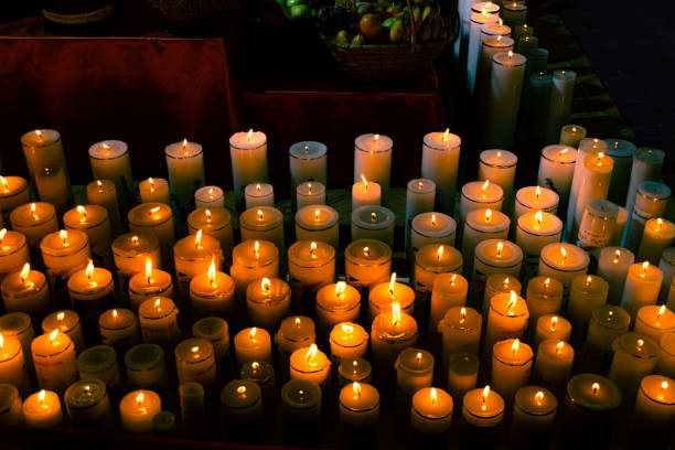 istock white candles lit in religious altar 1401052097