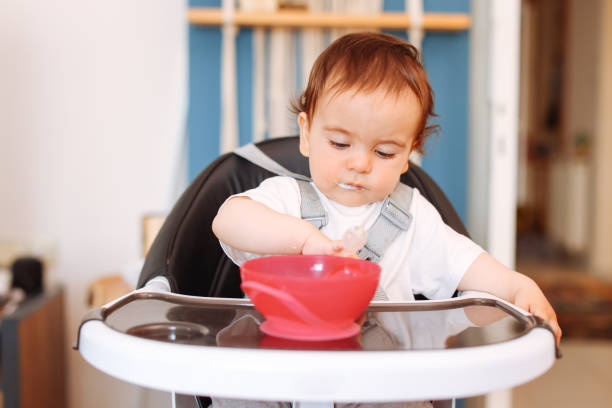istock Happy baby eating himself 1401058101