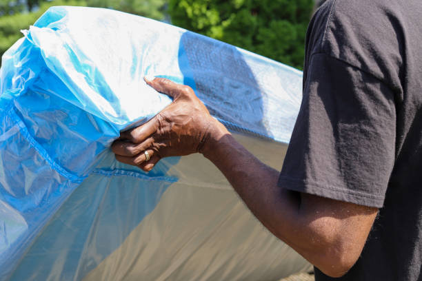 A black African-American man delivering a new mattress stock photo