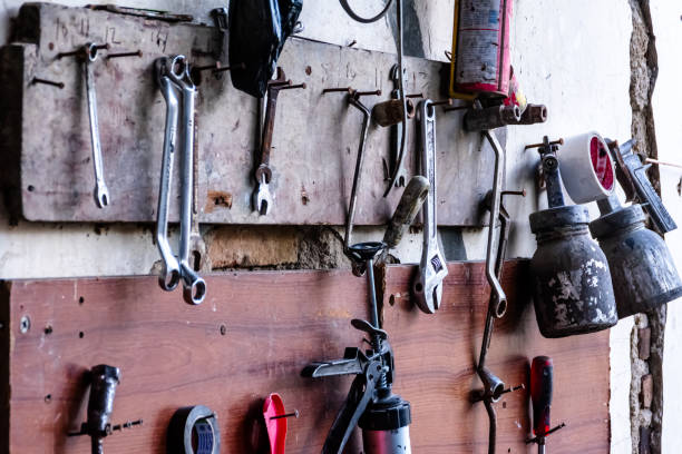 istock various garage tools for a workshop for auto service and car repair hangs on the wood wall 1401066872