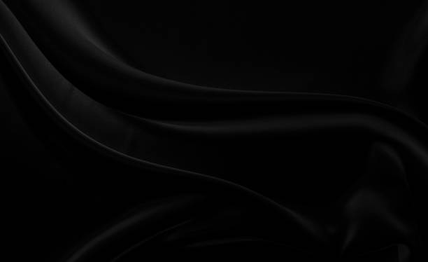 istock Black gray satin dark fabric texture luxurious shiny that is abstract silk cloth background with patterns soft waves blur beautiful. 1401067338