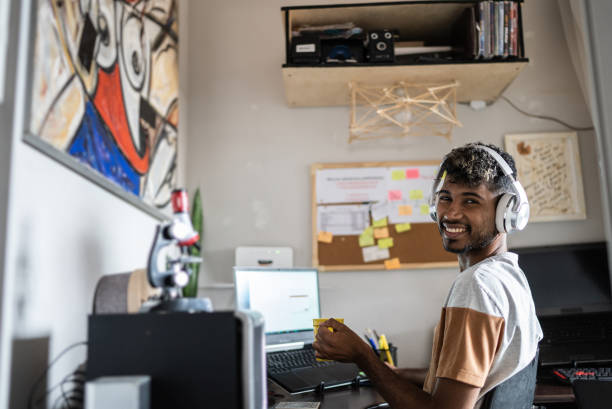 istock Portrait of a young man working or studying at home 1401068805