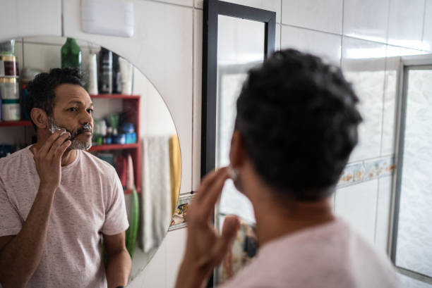 istock Mature man applying shaving foam on face 1401069399