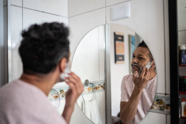 istock Mature man applying shaving foam on face 1401069414