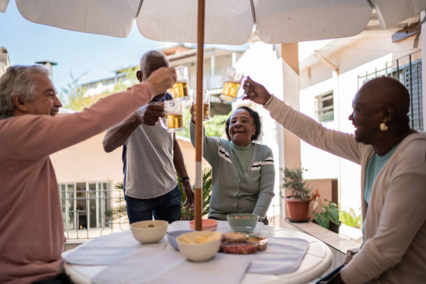 istock Senior friends toasting at home 1401069560