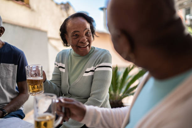 istock Senior women drinking beer at home 1401069670