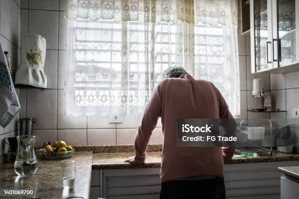 Senior Man Feeling Pain At Home Stock Photo - Download Image Now - Loneliness, Senior Adult, People
