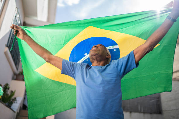 istock Senior man holding the Brazilian flag 1401070059