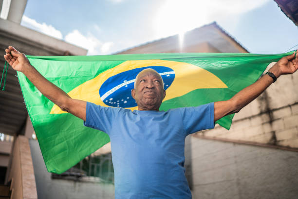 istock Senior man holding the Brazilian flag 1401070086