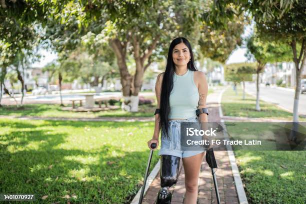 Portrait Of A Woman With Leg Prosthesis Stock Photo - Download Image Now - Disability, Persons with Disabilities, Crutch