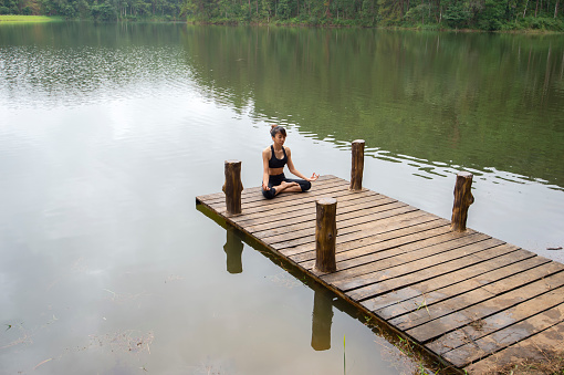 Yoga Young girl or people pose balance body vital zen meditation for workout nature mountain background in morning sunrise.Lifestyle woman yoga exercise and pose for healthy life.