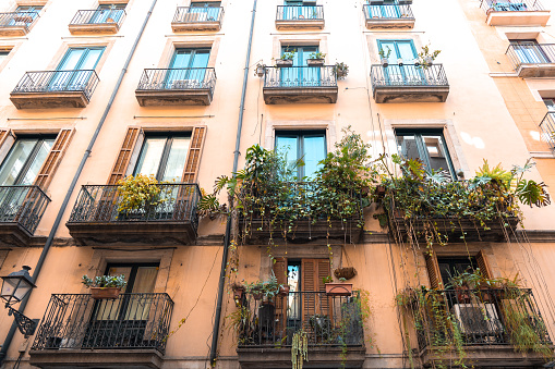 Classic apartment building with balconies and shutters in Barcelona