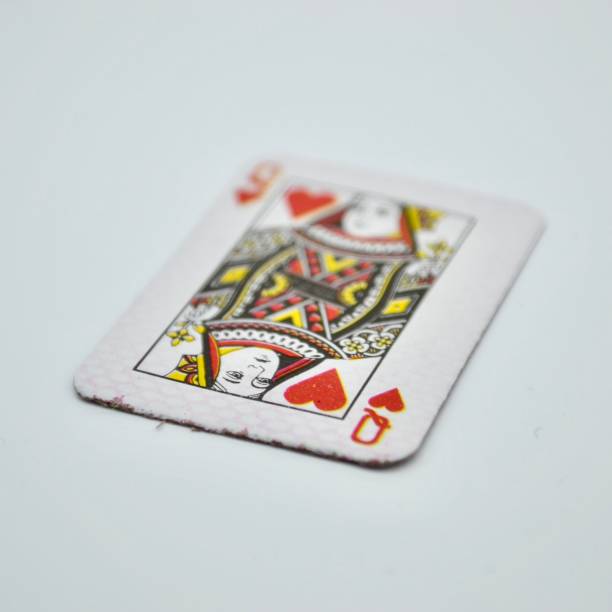 istock Single queen of hearts playing card on white background in studio shot 1401075665