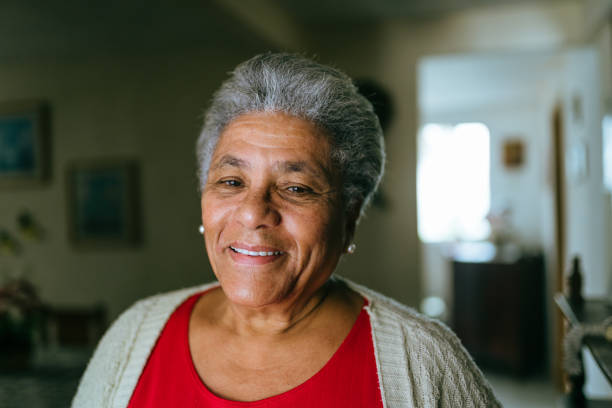 istock Smiling elderly woman at home 1401076425