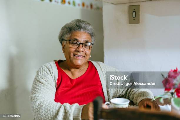 Smiling Elderly Woman Drinking Coffee At Home Stock Photo - Download Image Now - Senior Adult, Black People, One Woman Only