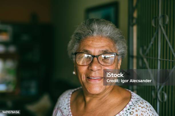 Portrait Of An Elderly Woman At Home Stock Photo - Download Image Now - One Woman Only, Portrait, Latin American and Hispanic Ethnicity