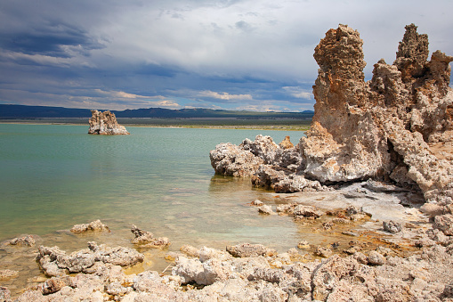Tall limestone towers, called tufa towers, rise from the salty and alkaline water of Mono Lake.