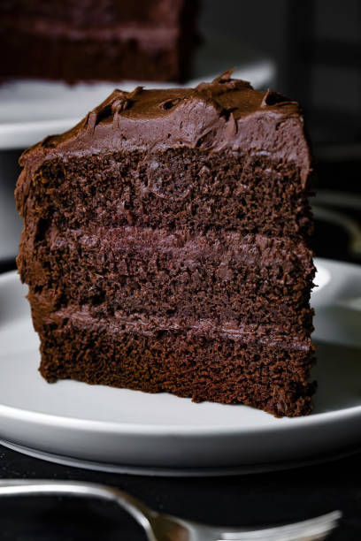 istock slice of delicious triple chocolate cake on a white plate 1401079966