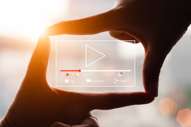 istock Concept of watching live video online, hands making framing view on blurred sunset background. 1401084809