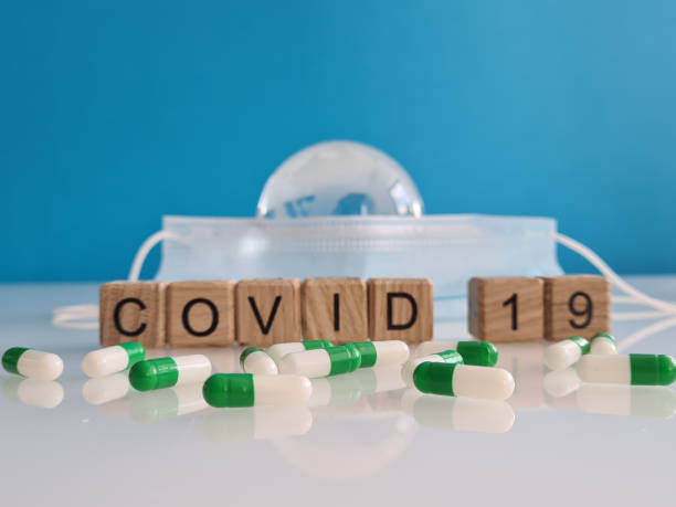 istock Covid-19 medical drugs protective mask and globe 1401085417