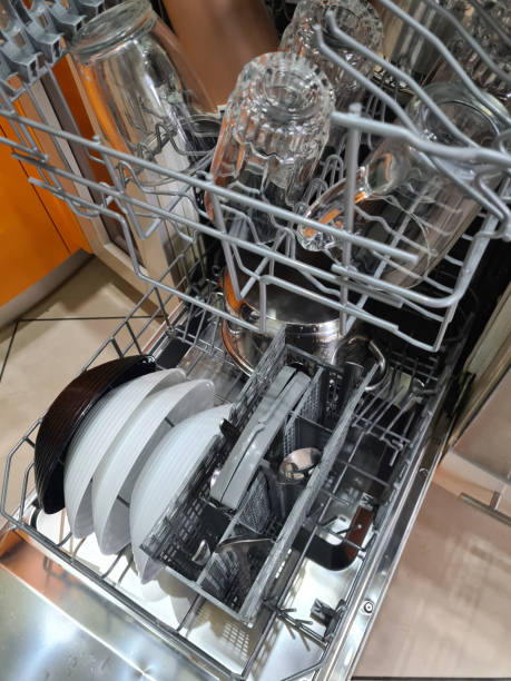 istock Clean dishes in dishwasher. Full load dishwashing machine 1401085605