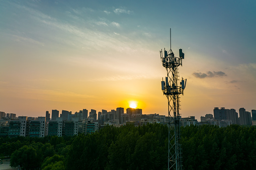Aerial view of 3G, 4G and 5G cellular networks communications tower