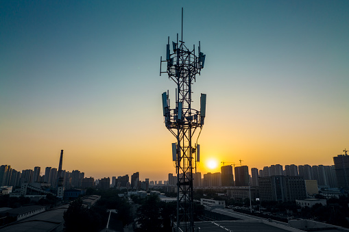 Aerial view of 3G, 4G and 5G cellular networks communications tower