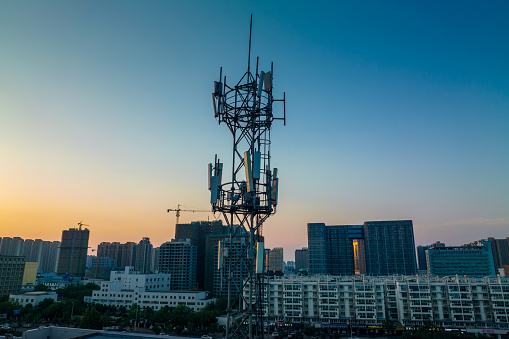 Aerial view of the top of telecommunication tower at sunset