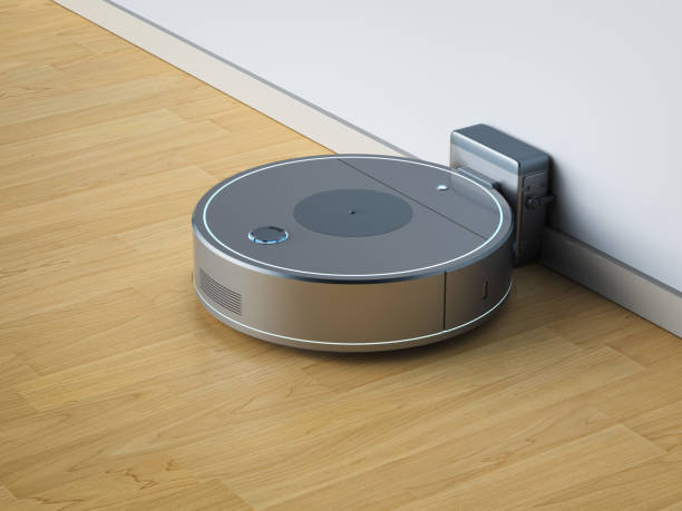istock Robotic vacuum cleaner or sweeper at charging station 1401088943