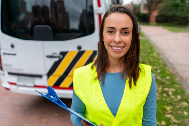 istock Crossing guard smiling next to a School Bus and smiling 1401090485