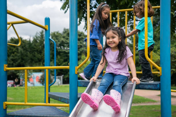 istock Happy children having fun playing in the playground 1401090545