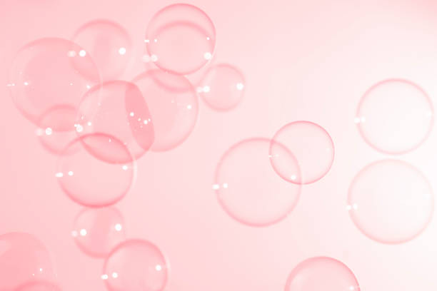 istock Abstract Beautiful Transparent Pink Soap Bubbles Background. Soap Sud Bubbles Water 1401093810