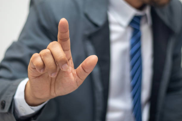 istock Businessman pointing at something or touching a touch screen on 1401093905