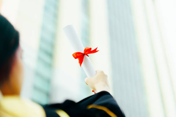 istock Graduated student showing a diplomas. 1401098925