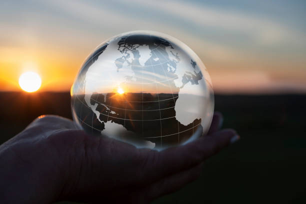 istock Globe in nature with nature inside in Scandinavian sunset. An illustration that shows how we should take care of nature 1401099822