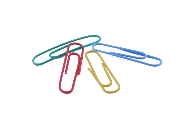 istock multicolored paper clips lie isolated on a white background 1401099979