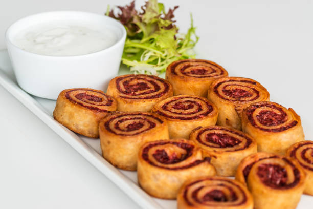 istock Delicious Cinnamon rolls on a plate with cream cheese on the side 1401108404