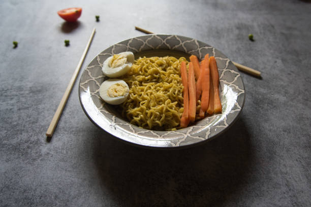 istock Cooked food ramen noodles served in a bowl on a background. 1401110324