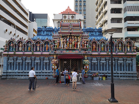 People praying at Sri Krishnan Temple, a Hindu temple in Singapore. Built in 1870 and gazetted as a national monument of Singapore in 2014, it is one of Singapore's oldest temples and is the only South Indian temple in Singapore dedicated to Krishna and his consort Rukmini.