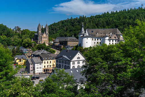 Clervaux, Luxembourg - 4 June, 2022: view of the picturesque and historic city center of Clervaux with castle and church in northern Luxembourg