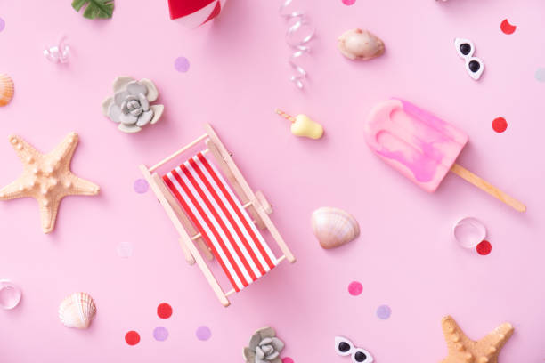 istock Accessories for beach holidays - deck chairs, umbrellas, ice cream top view. Beach party concept 1401113701