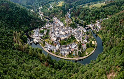 Esch-sur-Sure, Luxembourg - 4 June, 2022: drone view of the picturesque village of Esch-sur-Sure on the Sauer River in northern Luxembourg