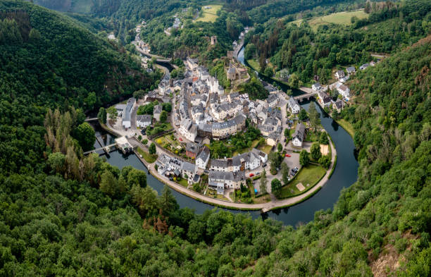 drone view of the picturesque village of Esch-sur-Sure on the Sauer River in northern Luxembourg Esch-sur-Sure, Luxembourg - 4 June, 2022: drone view of the picturesque village of Esch-sur-Sure on the Sauer River in northern Luxembourg luxemburg stock pictures, royalty-free photos & images